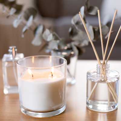 Collection of aromatic home scents including candles and diffusers